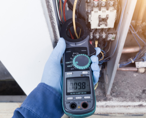 Checking the electric current in the HVAC air conditioning electrical system